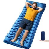 Oramoose sleeping pad setup demonstrates camping comfort on uneven ground with built-in pillow.