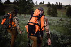 Reflective piping and paracord for night visibility in field.
