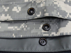 ORC USGI tarp ACU foliage sand side edge, durable grommets and snaps ready for setup.