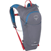 Osprey Moki kids biking backpack on trail, designed for stability during rides