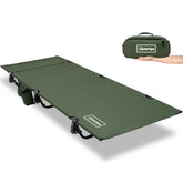 OuterSpa portable camping cot folded compact beside gear for easy transport