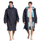 Owntop Swim Parka model at the beach showing windproof protection and easy changing.