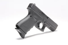 Pachmayr grip extender attached to Glock full-size frame, black