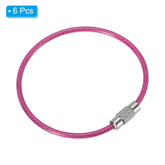 PATIKIL pink wire keychain securing keys and tags for travel use.