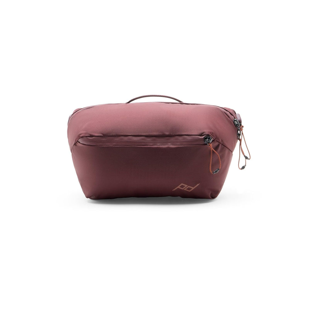 Peak Design Outdoor Sling 2L Eclipse strapped for comfortable crossbody wear