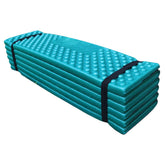 Pesoncarl foam sleeping pad with egg crate design cushions joints on uneven ground.