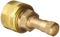 Petromax 12411 brass pump adapter beside a kerosene lantern for easy setup.