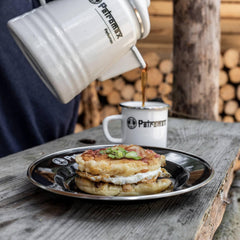 Petromax enamelware plate serving hot food straight from the grill