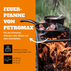 Petromax fire skillet outdoors over campfire, highlighting versatility.