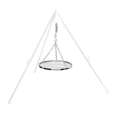 Petromax steel chains and grate swinging to gently cook over fire.