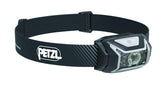 Petzl Actik Core headlamp front view with bright beam for outdoor adventures.