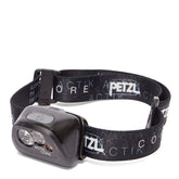 PETZL ACTIK CORE headlamp on, demonstrating compact light for hands-free outdoor activities