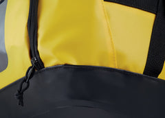 Petzl Duffel 65 side pocket stores helmet or shoes for separate storage.