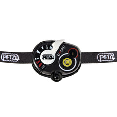 Petzl e+LITE locking switch close-up for accidental-activation protection