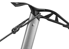 Petzl Glacier ice axe resting on snowy terrain demonstrating use.