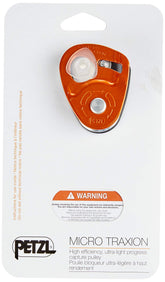 Petzl Micro Traxion pulley shown in compact form, ideal for crevasse rescue and emergency blocking.