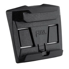 Petzl helmet mounting plate in use, enabling headlamp pivot without obstruction.