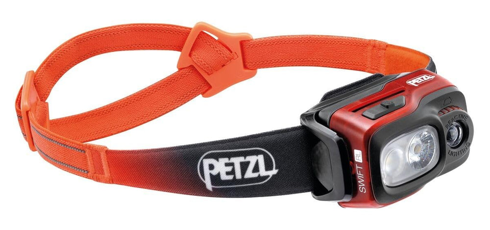 Petzl Swift RL headlamp front view in orange shows trail-ready illumination.
