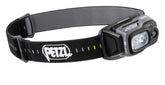 PETZL TACTIKKA ADAPT headlamp on a helmet for hands-free lighting.
