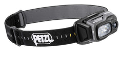 PETZL TACTIKKA ADAPT headlamp on a helmet for hands-free lighting.