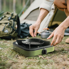 Propane portable camping stove in army green shows a stable base for safer outdoor cooking.