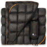 Puffer Wolf packable blanket in a stuff sack for easy travel.