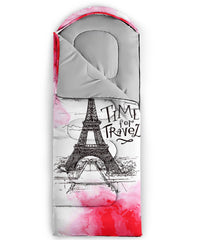 QOOMO pink Eiffel Tower sleeping bag packed in cylinder, travel-ready.