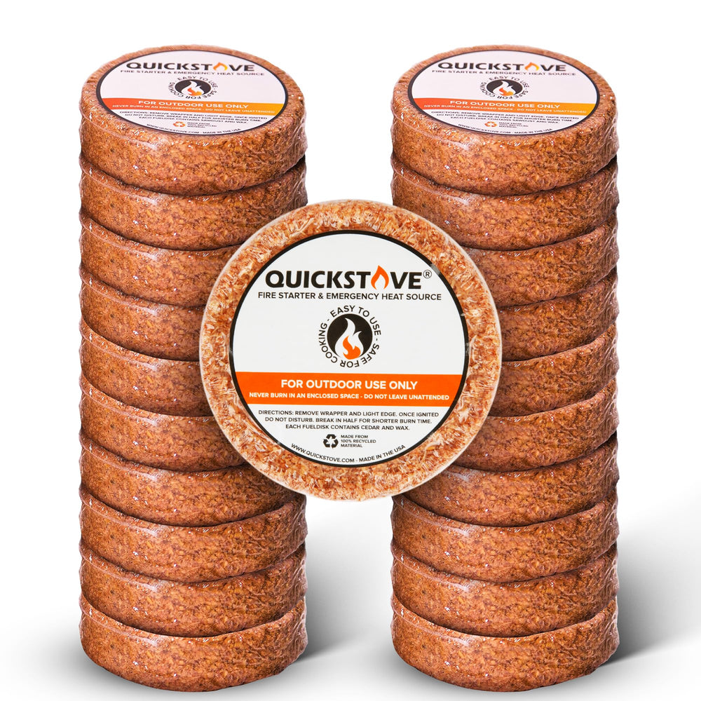QuickStove fire starter disk demonstrates long burn for camping meals.
