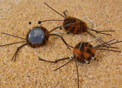 Region Fishing camo crab saltwater fly on Duratin hook for permit and bonefish.
