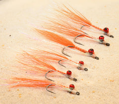 Region Fishing Crystal Clouser Minnow shows vivid lure pattern in sunlit water.