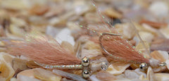 Region Fishing Mustad Duratin tan fly with weed guard reduces snags on grassy flats.
