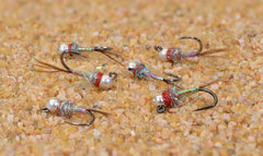 Region Fishing Rainbow Warrior tungsten bead jig fly with Hanak hooks improves casting and snag resistance.
