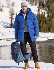 Rejork coat side profile in royal blue highlighting extended length for extra coverage.