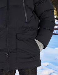 Rejork long winter coat hem-coverage detail emphasizes torso warmth in snowy days.