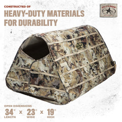 Rig'Em Right waterfowl dog blind camo blends with marsh grasses for discreet hunting.