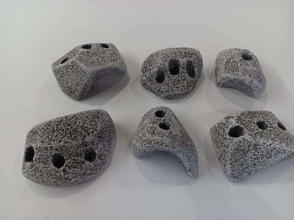 Rocky Mountain Holds granite texture demonstrates authentic grip for indoor climbing.