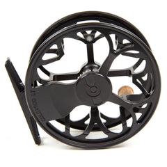 TIEMCO Colorado matte black 4/5 reel close-up highlighting compact diameter for lighter setups.