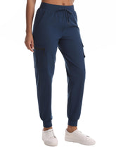 Rrosseyz women's hiking pants folded in dark blue showing compact, travel-ready design