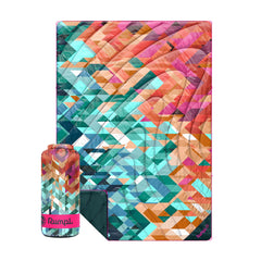 Rumpl Original Puffy Blanket laid flat showing 52x75 size for picnics and chilly evenings.