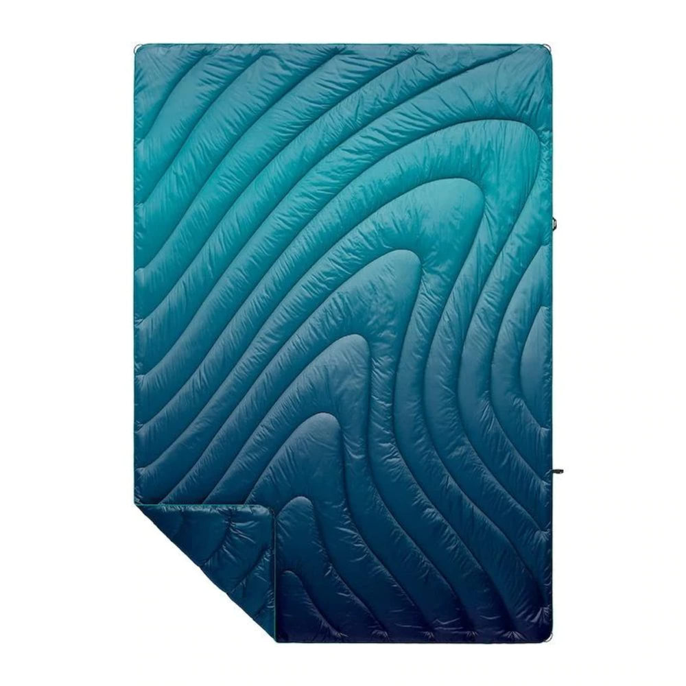 Rumpl Original Puffy Blanket Ocean Fade folded for compact storage and portability