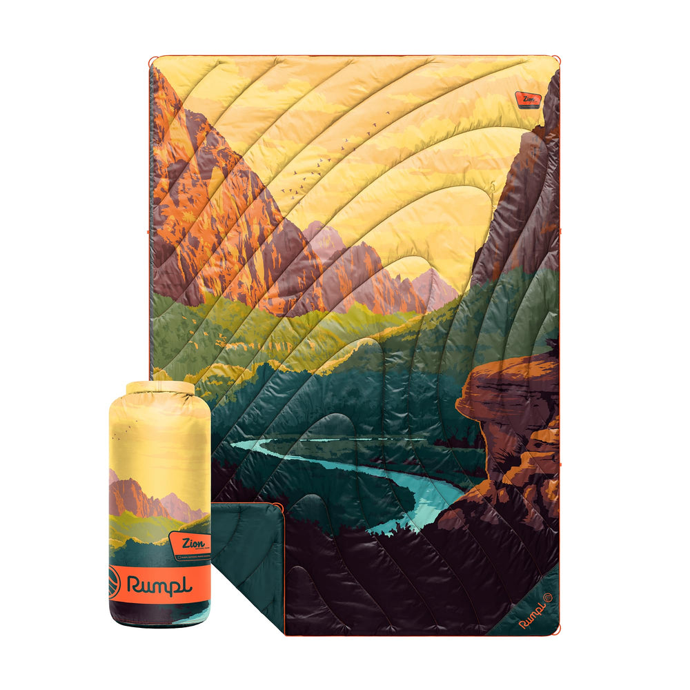 Rumpl Original Puffy Zion blanket compact pack demonstrates portable warmth for on-the-go camping.