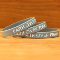 SayitBands Faith Over Fear wristband worn on the wrist during activity