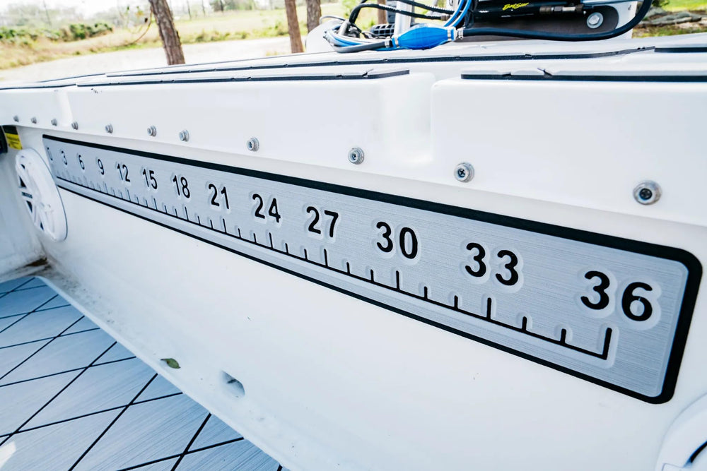 SeaDek Fishing Ruler 36 inch with 3M adhesive backing in storm gray and black on boat deck