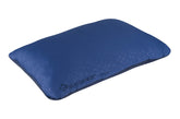 Sea to Summit FoamCore Deluxe Pillow rolled for travel and space saving.