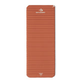 Sea to Summit Pursuit mat on campsite ground provides stable sleep surface for backpacking