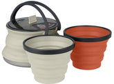 Sea to Summit X-Pot collapsible kettle in sand and rust for lightweight backcountry cooking.
