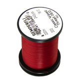 Semperfli Classic Waxed Thread 18/0 Red on a spool, ideal for precise fly tying.
