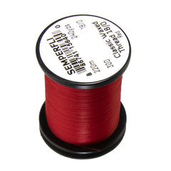 Semperfli Classic Waxed Thread 18/0 Red on a spool, ideal for precise fly tying.