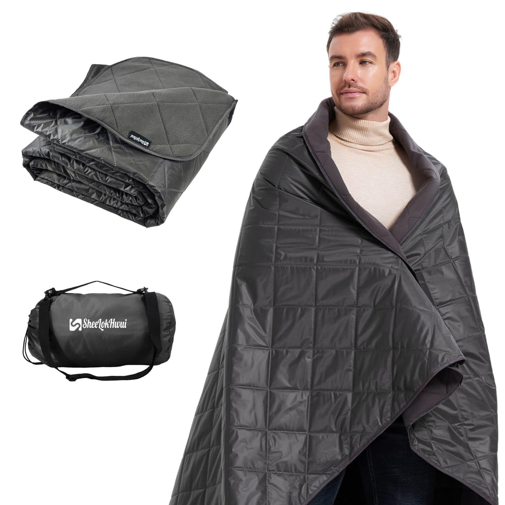 Sheelokhwui 4-in-1 blanket rolled in a compact carry bag for easy outdoor transport.