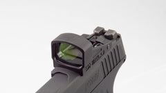 Shield Sights SMSc demonstrating co-witness with iron sights for versatile aiming.